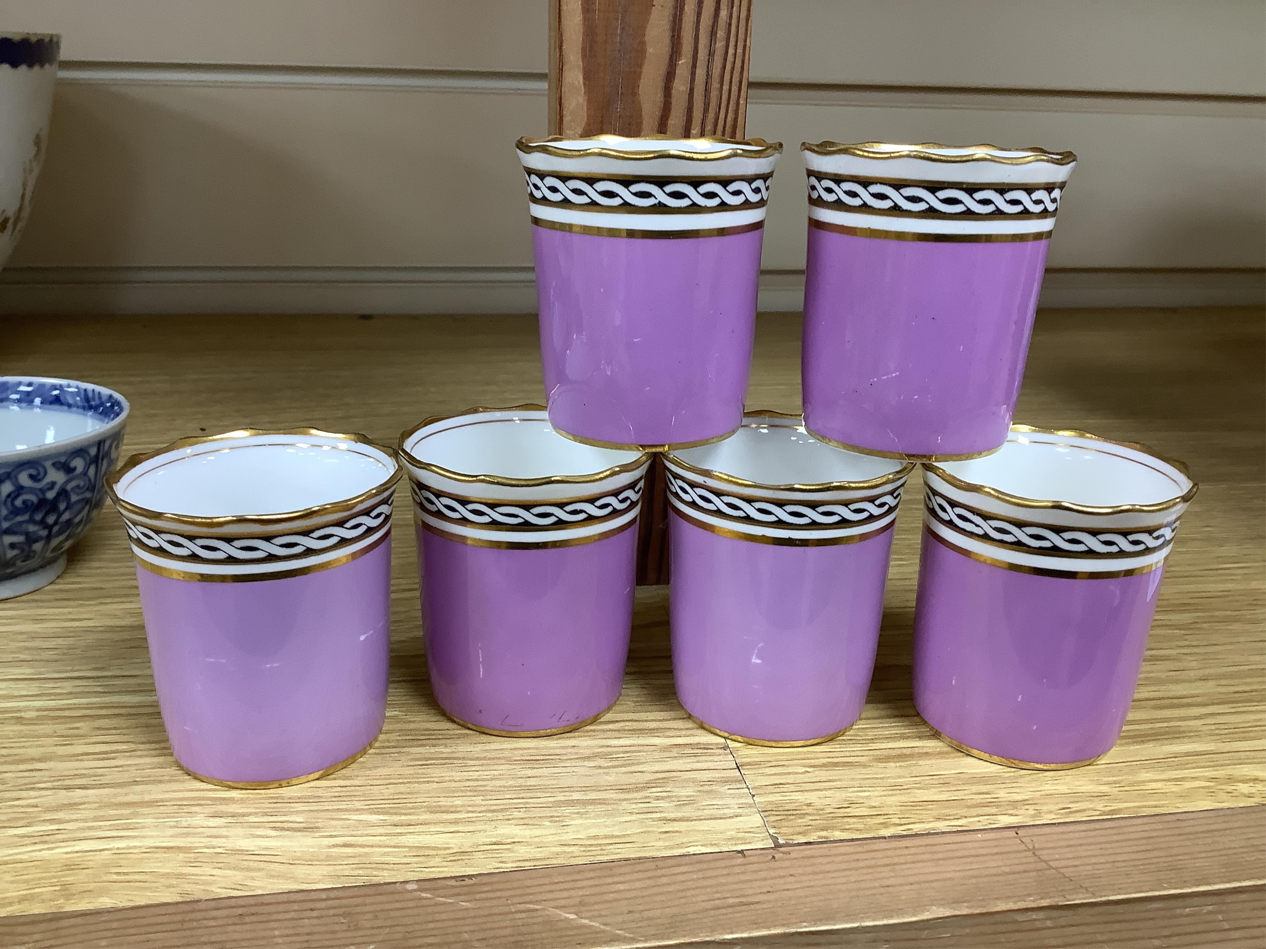 A cased Aynsley coffee set with silver mounted coffee cans and silver teaspoons, William Hutton & Sons, Sheffield, 1924, the leather case 38cm wide